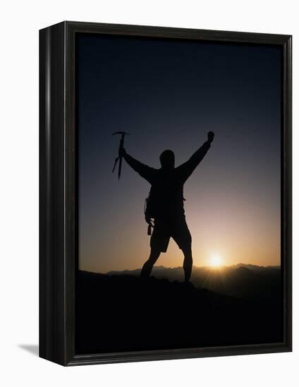 Mountain Climber Rejoices at the Summit at Sunrise-null-Framed Premier Image Canvas