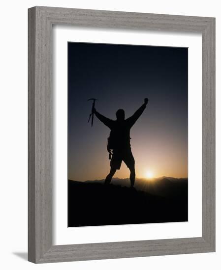 Mountain Climber Rejoices at the Summit at Sunrise-null-Framed Photographic Print