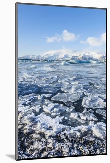 Mountains Behind the Frozen Water of Jokulsarlon Iceberg Lagoon, Jokulsarlon, South East Iceland-Neale Clark-Mounted Photographic Print