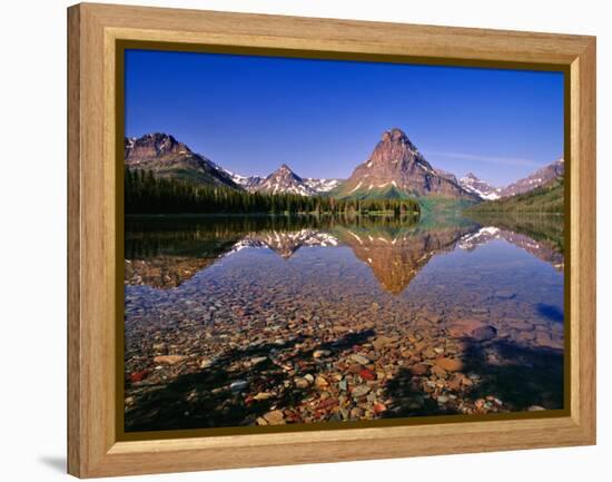 Mountains Reflect into Calm Two Medicine Lake, Glacier National Park, Montana, USA-Chuck Haney-Framed Premier Image Canvas