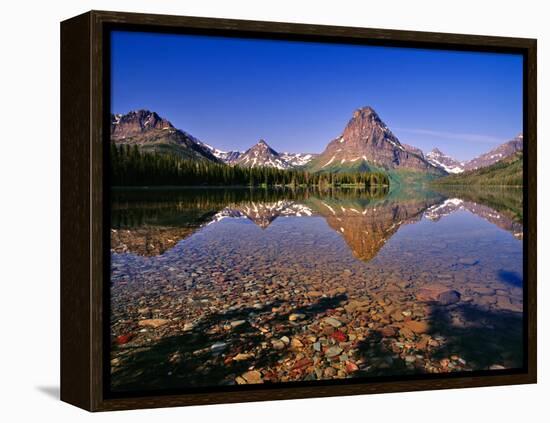 Mountains Reflect into Calm Two Medicine Lake, Glacier National Park, Montana, USA-Chuck Haney-Framed Premier Image Canvas