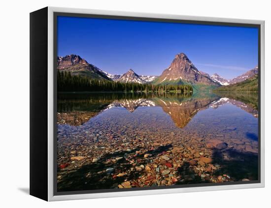 Mountains Reflect into Calm Two Medicine Lake, Glacier National Park, Montana, USA-Chuck Haney-Framed Premier Image Canvas