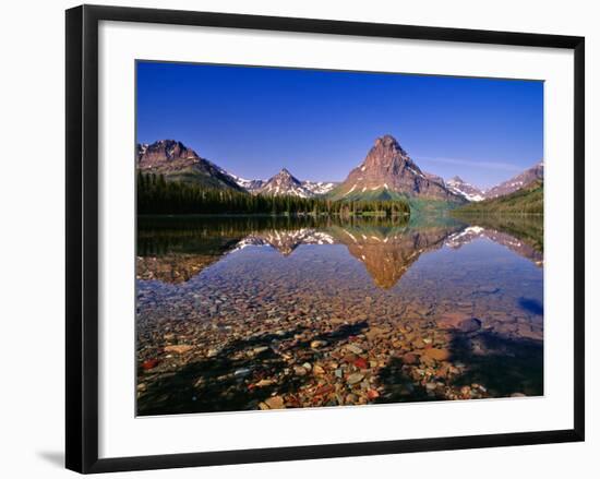 Mountains Reflect into Calm Two Medicine Lake, Glacier National Park, Montana, USA-Chuck Haney-Framed Photographic Print