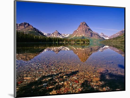 Mountains Reflect into Calm Two Medicine Lake, Glacier National Park, Montana, USA-Chuck Haney-Mounted Photographic Print