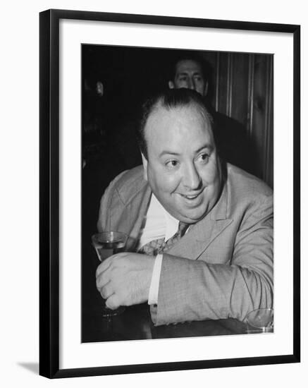 Movie Director Alfred Hitchcock Sits at Chasen's Bar While Enjoying a Cocktail Hour-Peter Stackpole-Framed Premium Photographic Print