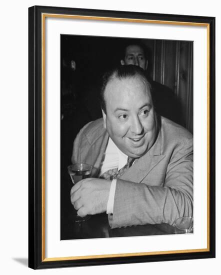 Movie Director Alfred Hitchcock Sits at Chasen's Bar While Enjoying a Cocktail Hour-Peter Stackpole-Framed Premium Photographic Print