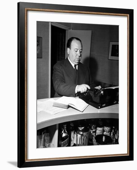 Movie Director Alfred Hitchcock Typing Script on a Portable Typewriter-Peter Stackpole-Framed Premium Photographic Print