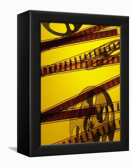 Movie Film and Reel in Yellow Light-null-Framed Premier Image Canvas