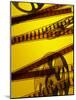 Movie Film and Reel in Yellow Light-null-Mounted Photographic Print