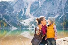 Happy Mother and Baby Pointing on Copy Space While on Lake Braies in South Tyrol, Italy-Mr Alliance-Framed Premier Image Canvas