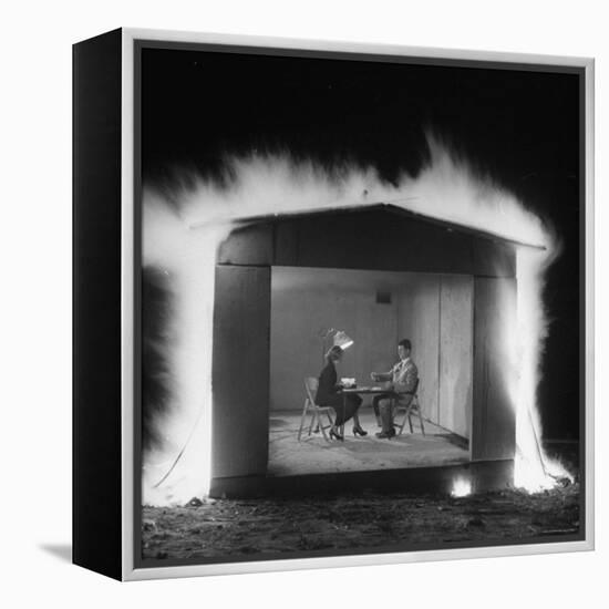 Mr. and Mrs. Andrew Andeck Nonchalantly Playing Double Solitaire While Safelite Garage Flames-Allan Grant-Framed Premier Image Canvas