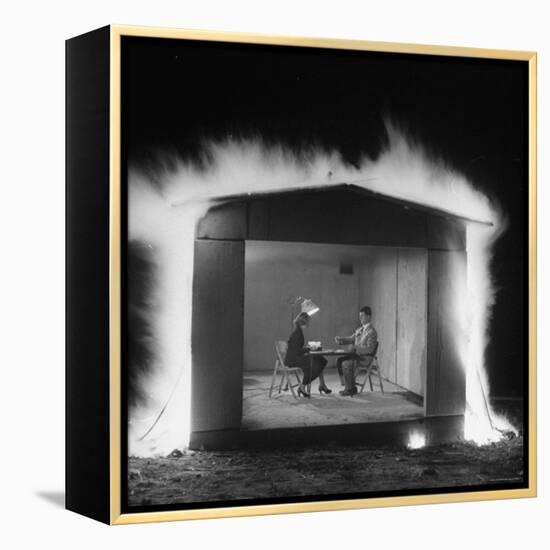 Mr. and Mrs. Andrew Andeck Nonchalantly Playing Double Solitaire While Safelite Garage Flames-Allan Grant-Framed Premier Image Canvas