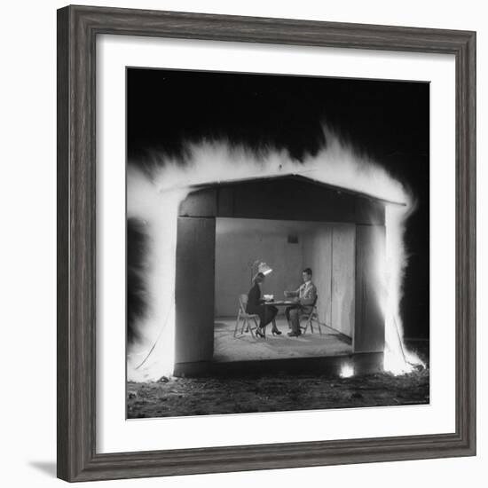 Mr. and Mrs. Andrew Andeck Nonchalantly Playing Double Solitaire While Safelite Garage Flames-Allan Grant-Framed Photographic Print