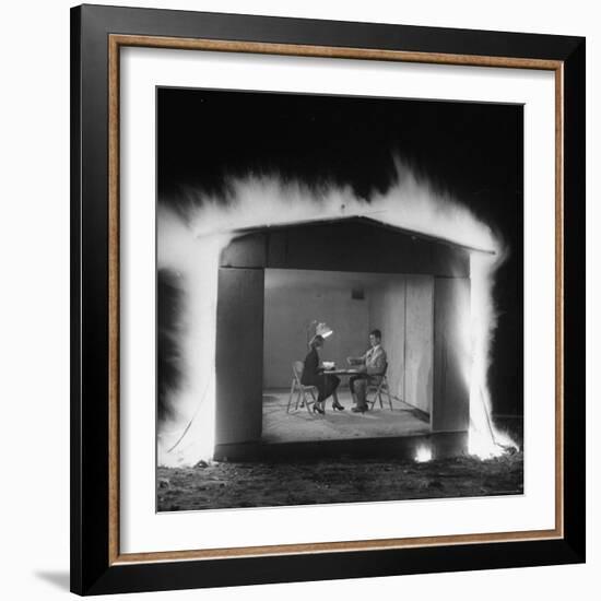 Mr. and Mrs. Andrew Andeck Nonchalantly Playing Double Solitaire While Safelite Garage Flames-Allan Grant-Framed Photographic Print