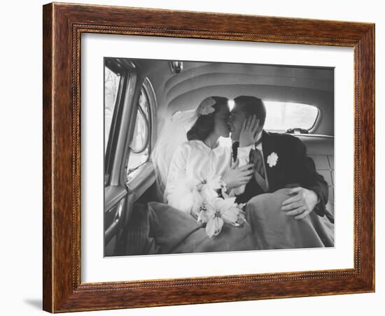 Mr. and Mrs. Thomas Beagan Jr. Kissing in Back of Car after their Wedding Ceremony-Ed Clark-Framed Photographic Print