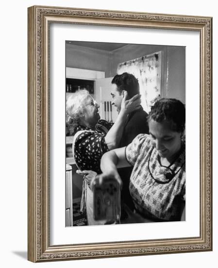 Mrs. Alfonso La Falce Kissing Baby Son at Family Reunion Dinner-Ralph Morse-Framed Photographic Print