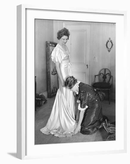 Mrs. Elizabeth Arden Graham Having Her Maid Fix Hem of Evening Gown-Alfred Eisenstaedt-Framed Premium Photographic Print