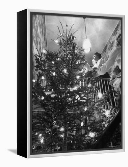 Mrs. George Sutton and Her Family Decorating Their Christmas Tree at Home-Ralph Crane-Framed Premier Image Canvas