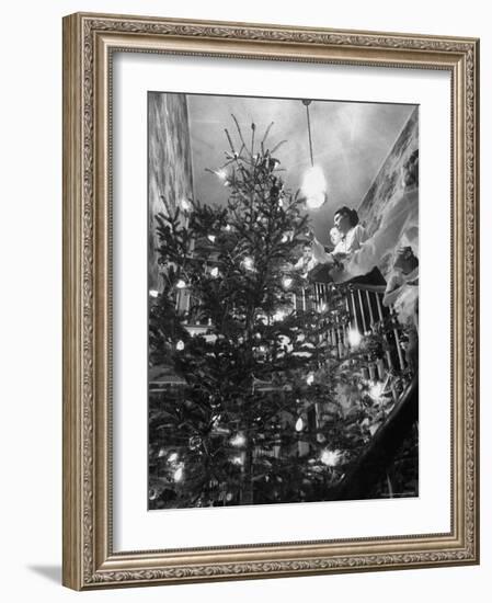 Mrs. George Sutton and Her Family Decorating Their Christmas Tree at Home-Ralph Crane-Framed Photographic Print