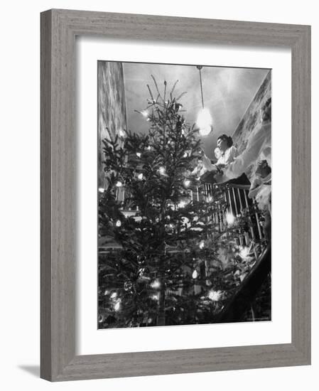 Mrs. George Sutton and Her Family Decorating Their Christmas Tree at Home-Ralph Crane-Framed Photographic Print