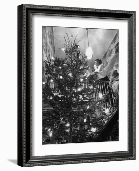 Mrs. George Sutton and Her Family Decorating Their Christmas Tree at Home-Ralph Crane-Framed Photographic Print