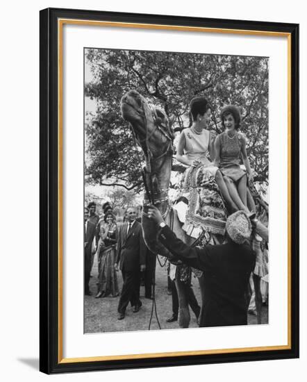 Mrs. John F. Kennedy and Princess Stanislas Radziwill Riding Camel-null-Framed Premium Photographic Print