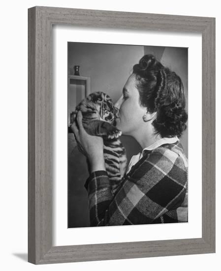 Mrs. Martini, Wife of the Bronx Zoo Lion Keeper, Kissing a Tiger Cub-Alfred Eisenstaedt-Framed Photographic Print