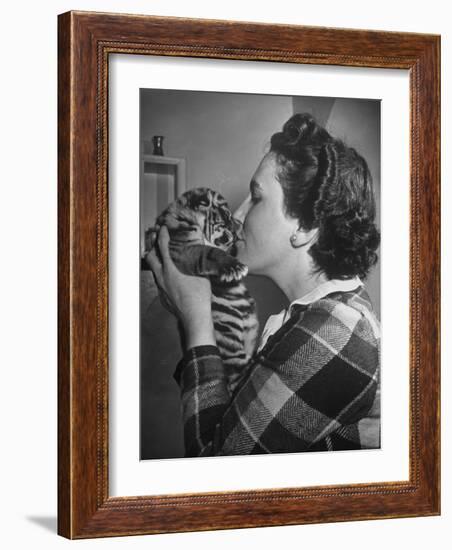 Mrs. Martini, Wife of the Bronx Zoo Lion Keeper, Kissing a Tiger Cub-Alfred Eisenstaedt-Framed Photographic Print