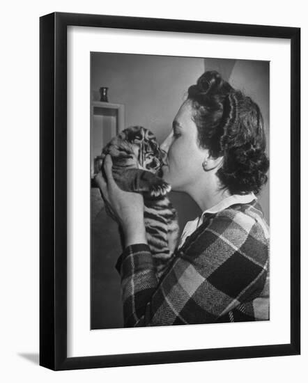 Mrs. Martini, Wife of the Bronx Zoo Lion Keeper, Kissing a Tiger Cub-Alfred Eisenstaedt-Framed Photographic Print