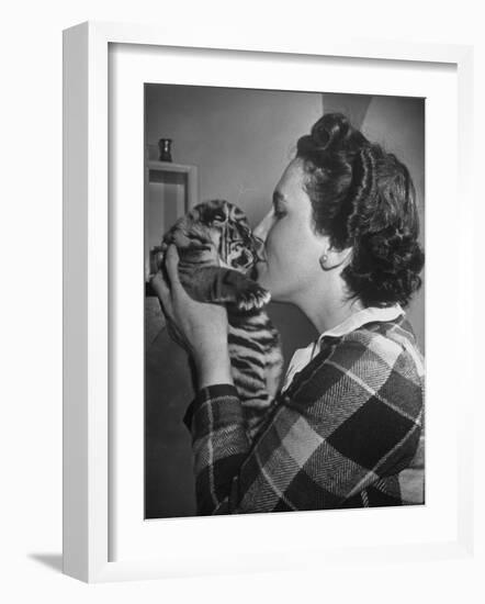 Mrs. Martini, Wife of the Bronx Zoo Lion Keeper, Kissing a Tiger Cub-Alfred Eisenstaedt-Framed Photographic Print