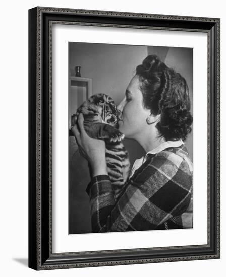 Mrs. Martini, Wife of the Bronx Zoo Lion Keeper, Kissing a Tiger Cub-Alfred Eisenstaedt-Framed Photographic Print