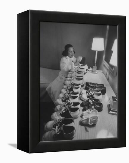 Mrs. Ottilie King Lining Up Her Children's Shoes-Stan Wayman-Framed Premier Image Canvas