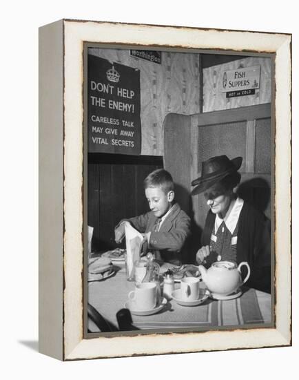 Mrs. Robert Neve and Son Peter Eating Supper in Restaurant-Hans Wild-Framed Premier Image Canvas