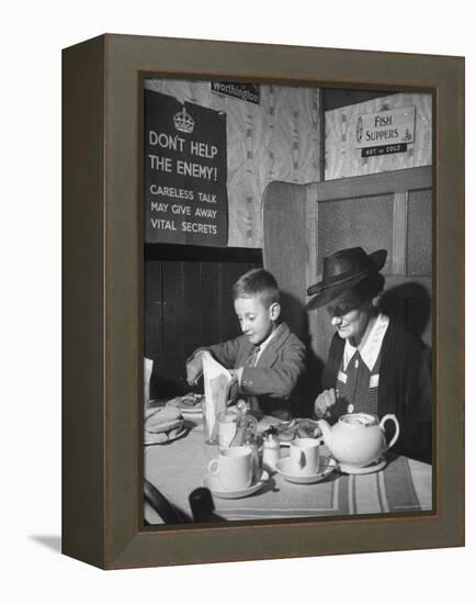 Mrs. Robert Neve and Son Peter Eating Supper in Restaurant-Hans Wild-Framed Premier Image Canvas