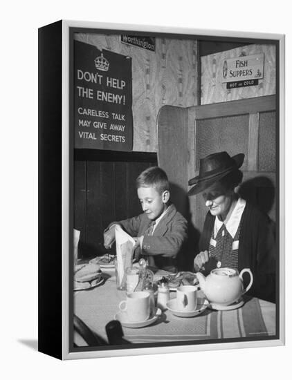 Mrs. Robert Neve and Son Peter Eating Supper in Restaurant-Hans Wild-Framed Premier Image Canvas