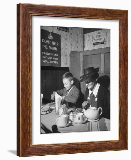 Mrs. Robert Neve and Son Peter Eating Supper in Restaurant-Hans Wild-Framed Photographic Print