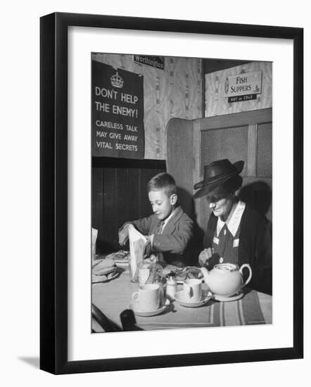 Mrs. Robert Neve and Son Peter Eating Supper in Restaurant-Hans Wild-Framed Photographic Print