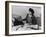 Mrs Teruko Kiyomura, bookkeeper, seated at desk, operating an adding machine while reading a ledger-Ansel Adams-Framed Photographic Print