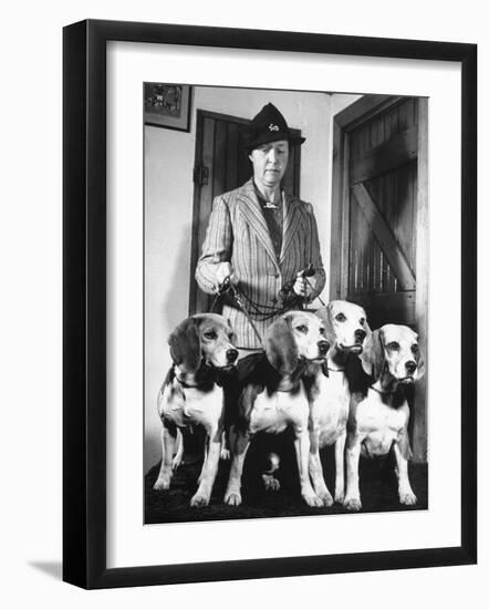 Mrs. William Dupont Jr. Holding Reins of Four Beagles That Belonged to Her Late Husband-Hansel Mieth-Framed Photographic Print