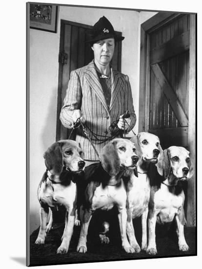 Mrs. William Dupont Jr. Holding Reins of Four Beagles That Belonged to Her Late Husband-Hansel Mieth-Mounted Photographic Print