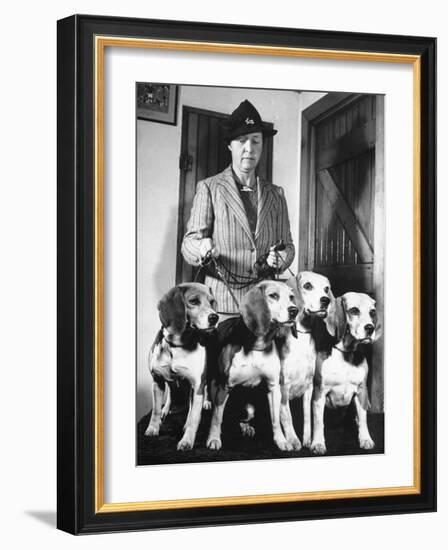 Mrs. William Dupont Jr. Holding Reins of Four Beagles That Belonged to Her Late Husband-Hansel Mieth-Framed Photographic Print