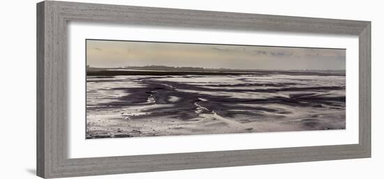 Mud flats of Pagham Harbour nature reserve are softly lit at low tide-Charles Bowman-Framed Photographic Print