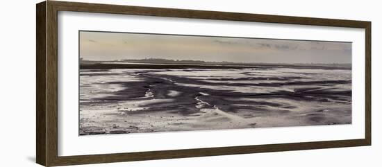 Mud flats of Pagham Harbour nature reserve are softly lit at low tide-Charles Bowman-Framed Photographic Print