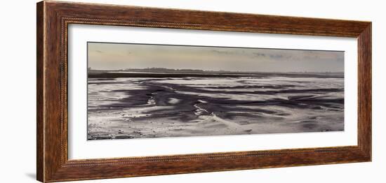 Mud flats of Pagham Harbour nature reserve are softly lit at low tide-Charles Bowman-Framed Photographic Print