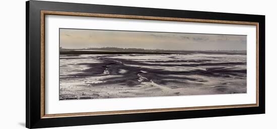 Mud flats of Pagham Harbour nature reserve are softly lit at low tide-Charles Bowman-Framed Photographic Print