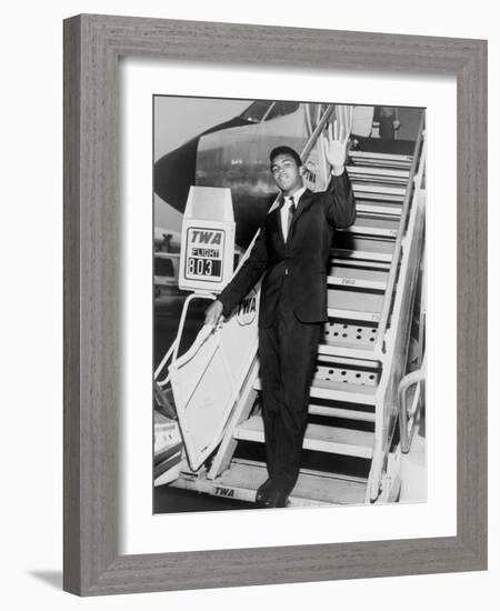 Muhammad Ali, Waves from the Steps of a TWA Airplane at JFK Airport, NYC, 1964-null-Framed Photo
