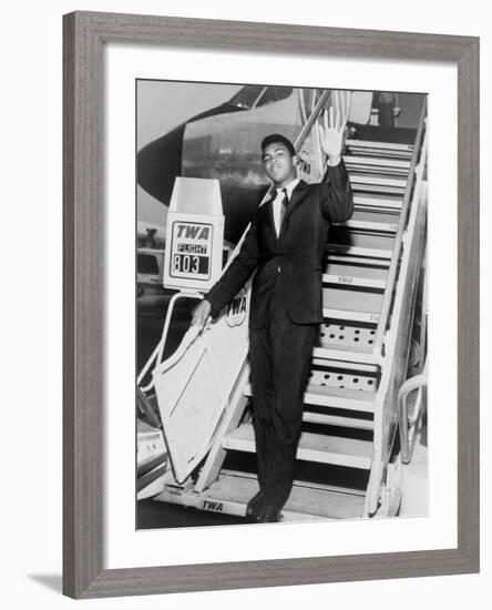 Muhammad Ali, Waves from the Steps of a TWA Airplane at JFK Airport, NYC, 1964-null-Framed Photo