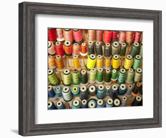 Multi-colored thread in high school sewing class-null-Framed Photographic Print