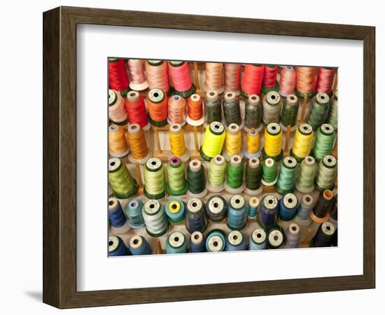 Multi-colored thread in high school sewing class-null-Framed Photographic Print