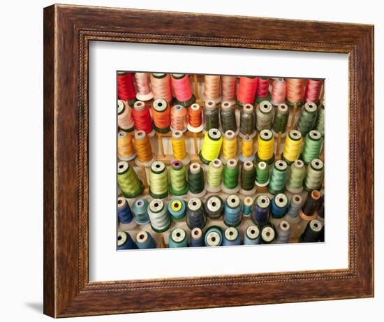 Multi-colored thread in high school sewing class-null-Framed Photographic Print